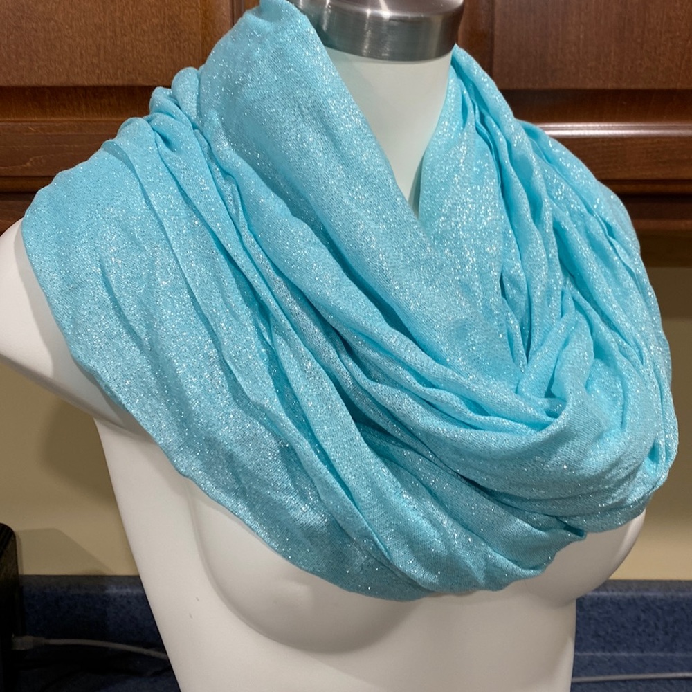 Calvin Klein scarf light blue with sparkle.